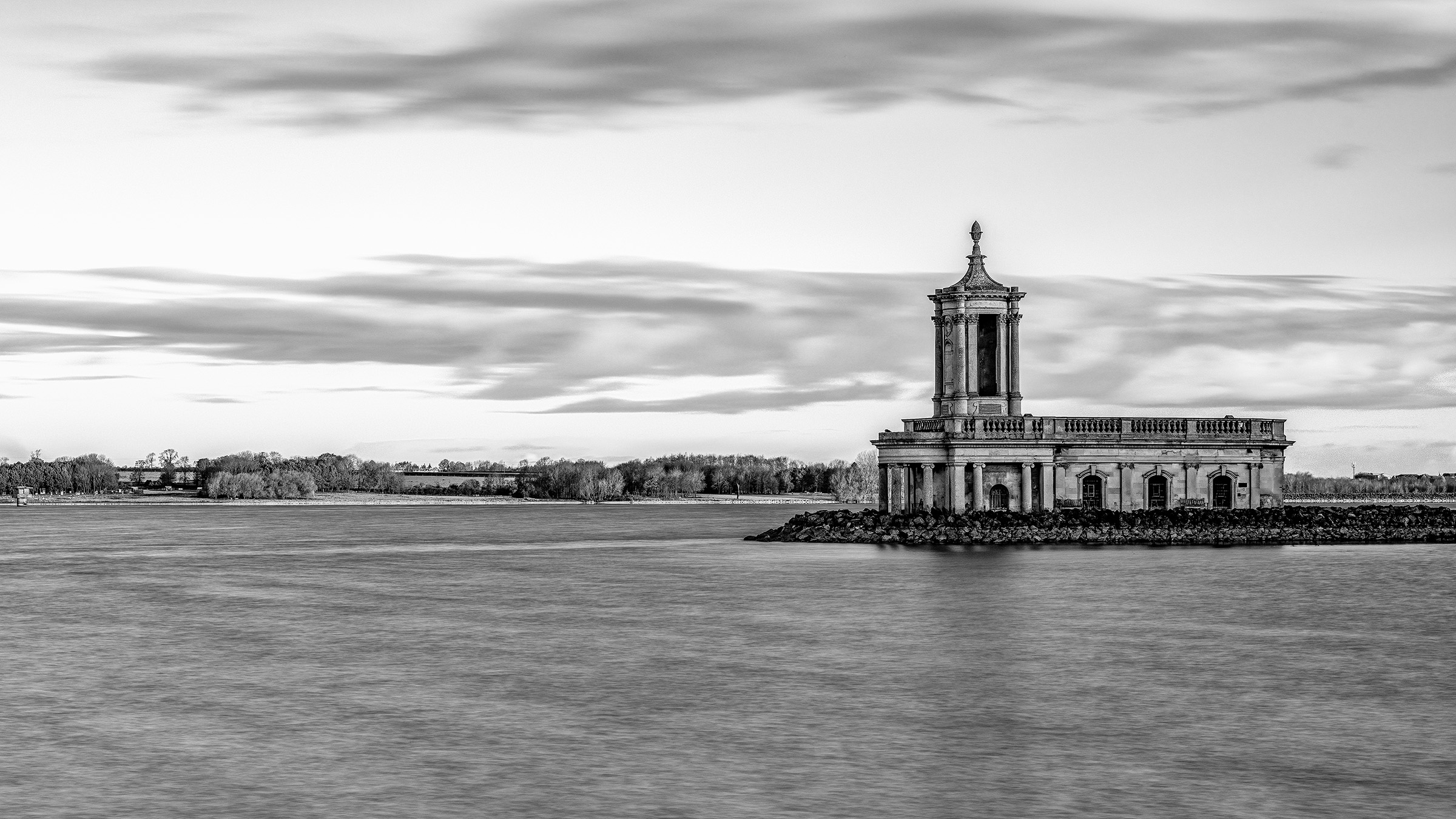Black-and-white long-exposure photograph of Normanton Church